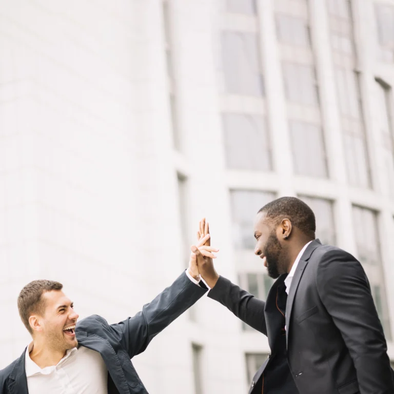 Men giving high five for closed deal
